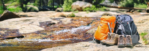 hiking gear near creek