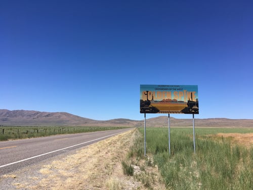 golden spike road sign